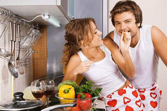 a woman feeds a man products for power