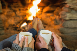 the couple in front of the fire